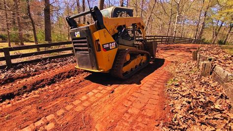 cutting driveway with skid steer|SkidSteer Cutting in Driveway with a Cutting.